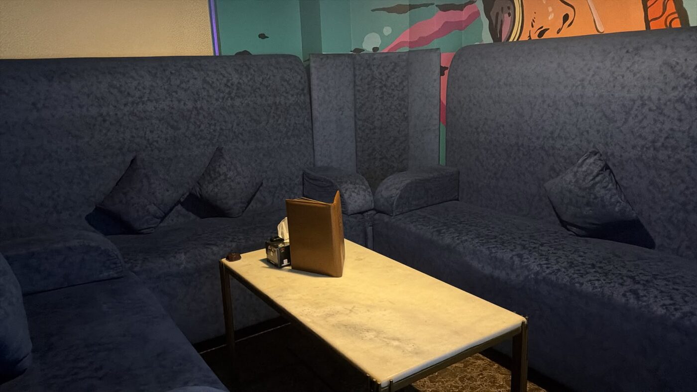 A private booth room with a screen