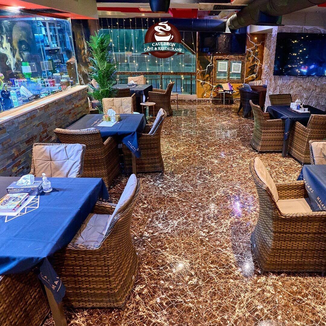Upstairs at The Cauldron: screens, blue tables and match nights
